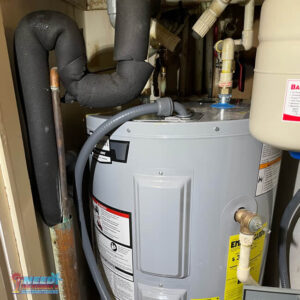 Professional water heater install in a tight place to code